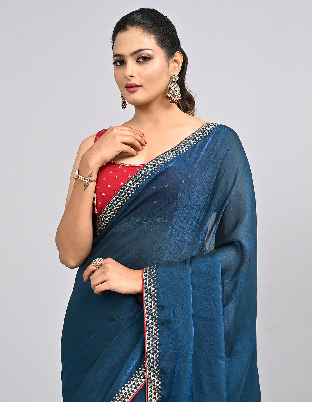 Zehra – Teal Blue Chinnon Saree with Swarovski Stone Border & Contrast Embroidered Blouse | Fazals
