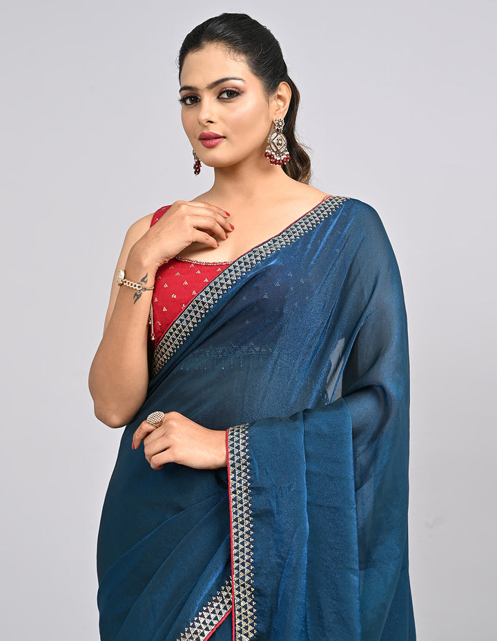 Zehra – Teal Blue Chinnon Saree with Swarovski Stone Border & Contrast Embroidered Blouse | Fazals