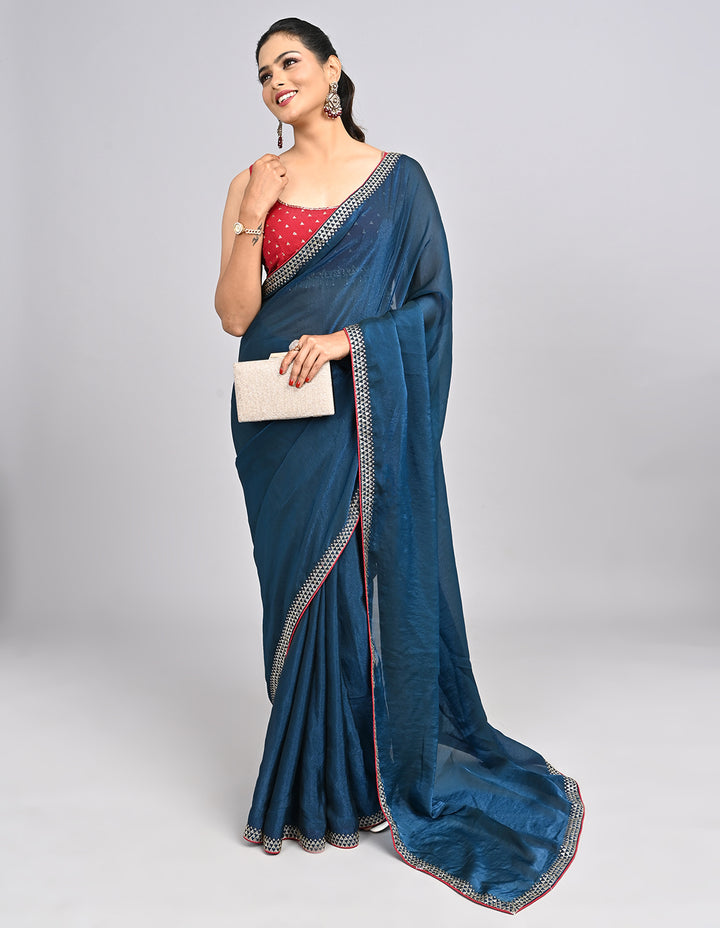 Zehra – Teal Blue Chinnon Saree with Swarovski Stone Border & Contrast Embroidered Blouse | Fazals