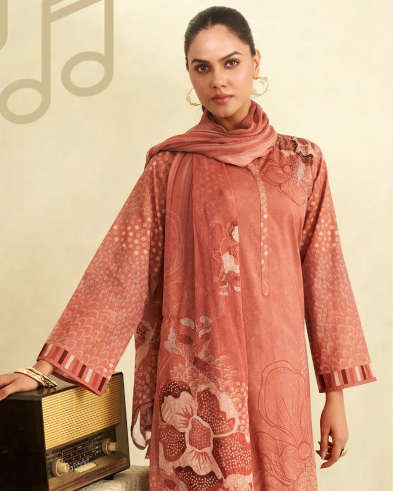 Fazals pink traditional outfit with a patterned scarf, standing next to a vintage radio on a beige background.
